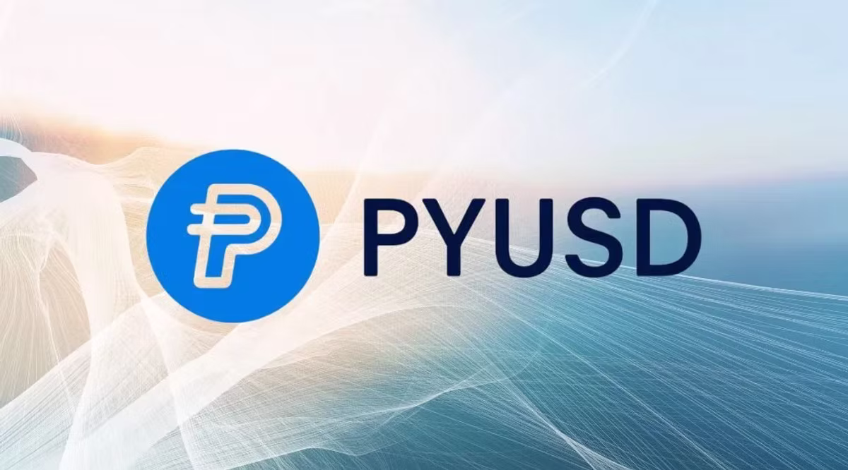 Blue logo with stylized "P" next to "PYUSD" text on a light, abstract background with white and blue gradient lines.